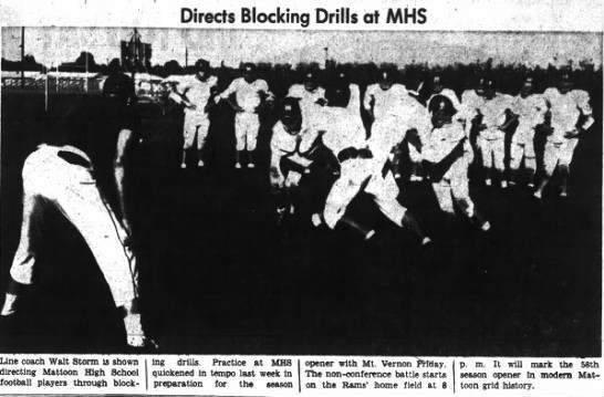 Coach Walt Storm directs blocking drills